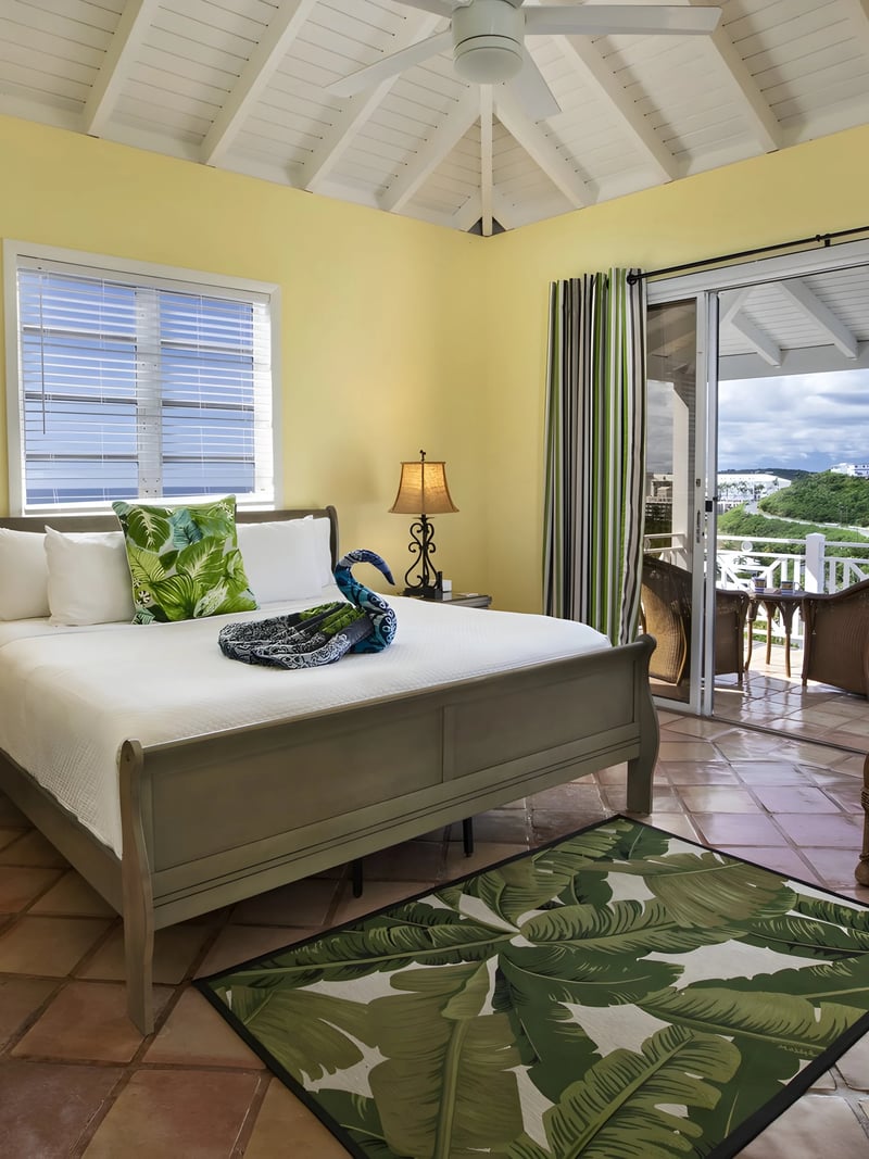 CalypsoBlu tropical bedroom with balcony access